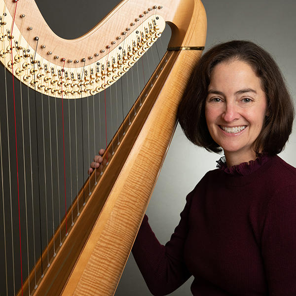 Michelle Lundy with a harp