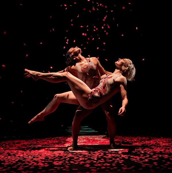One dancer holding another